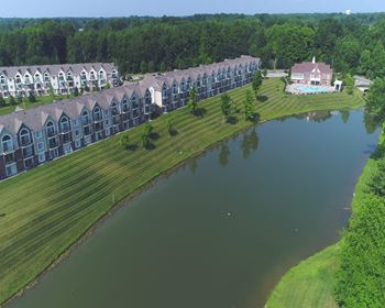 Arial view of a lake with a building in the background